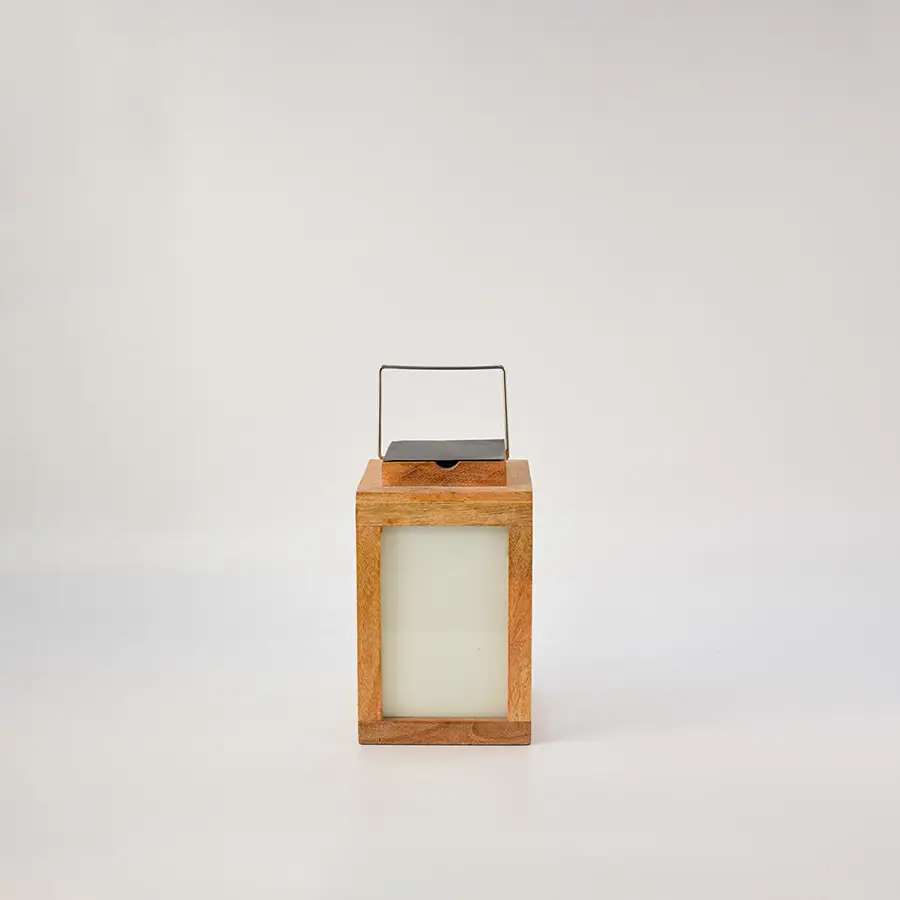 Wooden lantern with frosted glass panels and metal handle for modern tabletop and home decor styling.
