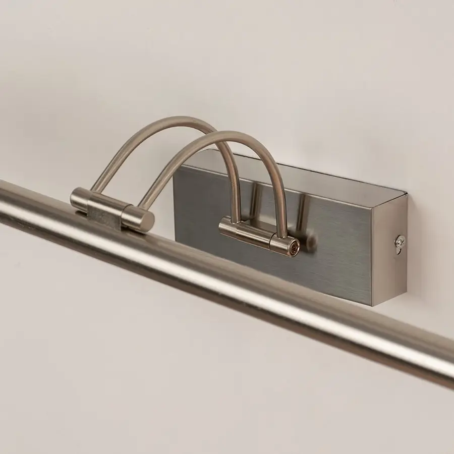 Closeup view of modern metal picture light with slim adjustable bar for focused wall illumination.