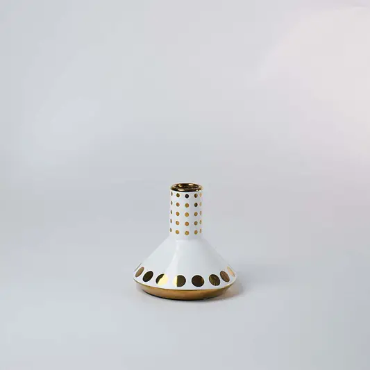 White ceramic mini vase featuring shiny gold geometric patterns and dots on white background for classic elegant styling.