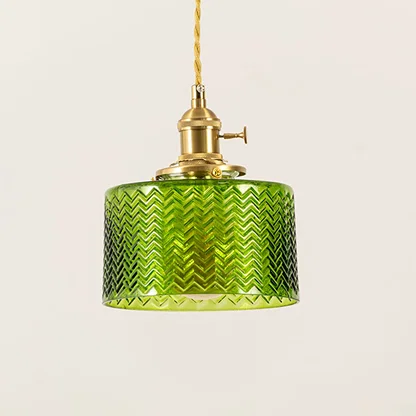 Closeup of green textured glass and brass metal pendant light showcasing premium craftsmanship.