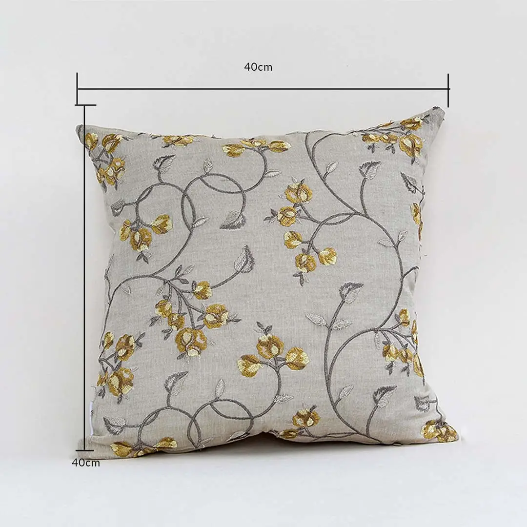 Cushion cover with yellow floral design shown with height and width guides marking its exact 40 cm x 40 cm size helping users choose the right option for home décor.
