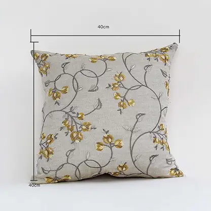 Cushion cover with yellow floral design shown with height and width guides marking its exact 40 cm x 40 cm size helping users choose the right option for home décor.