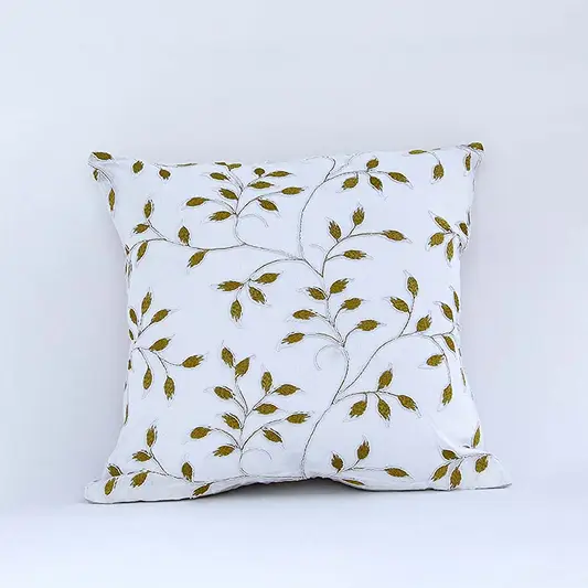 White cotton cushion cover with yellow botanical leaf print for sofa couch bedroom and stylish home decor accents.