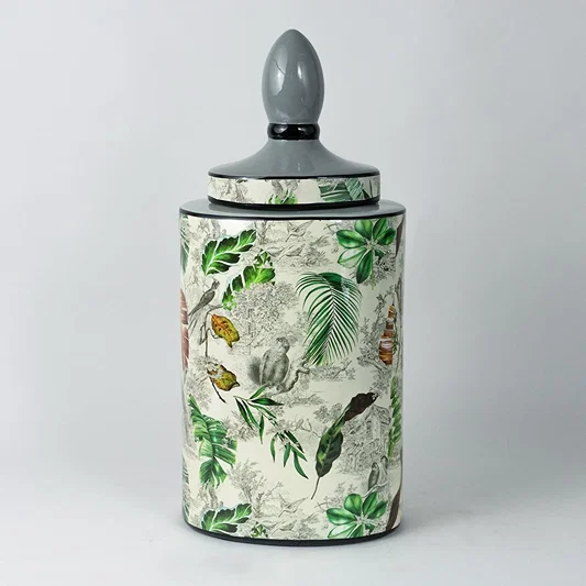 Tropical leaf jar with elegant botanical design shown clearly on a plain white background.