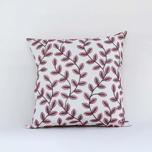 White cotton cushion cover with colorful floral print for sofa bedroom seating and fresh modern home styling.