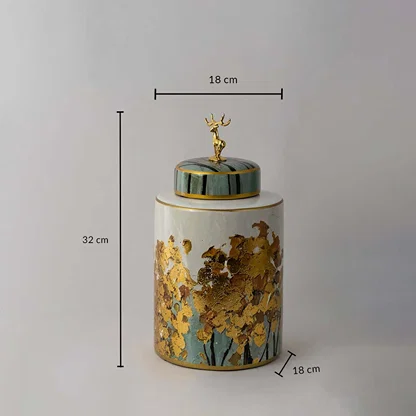Cylindrical ceramic jar with gold tree texture and teal deer lid shown with 32 cm height and 18 cm width for size guide.