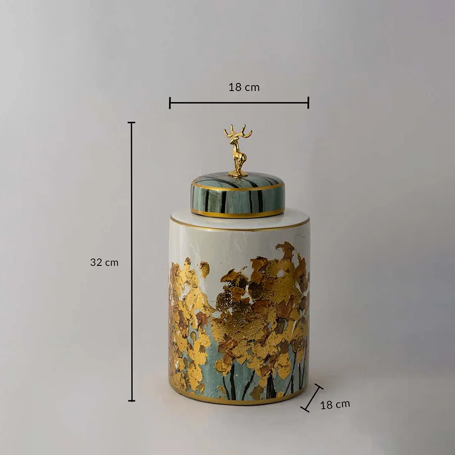 Cylindrical ceramic jar with gold tree texture and teal deer lid shown with 32 cm height and 18 cm width for size guide.