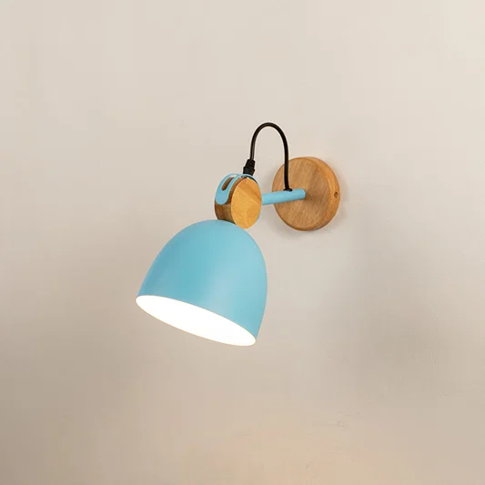 Modern wall light with blue metal shade and wooden backplate ideal for bedroom bedside or living room wall decor on clean background.