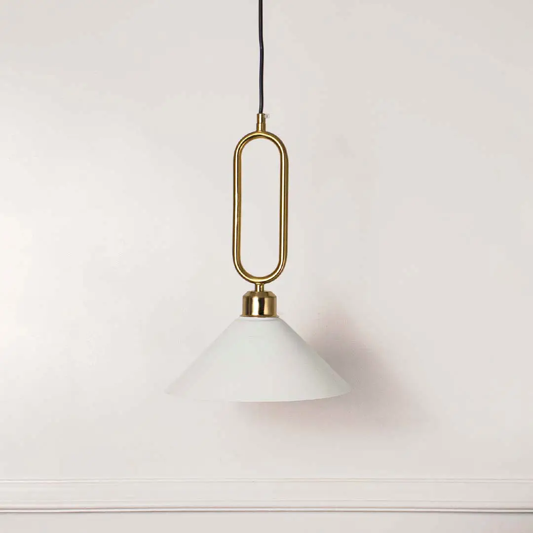 Minimal white glass pendant light with gold geometric holder hanging against soft neutral wall background suitable for luxury interior decor.

