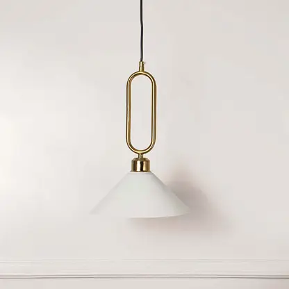 Minimal white glass pendant light with gold geometric holder hanging against soft neutral wall background suitable for luxury interior decor.

