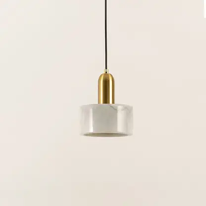 Minimalist white marble pendant light with cylindrical design created for elegant living spaces.