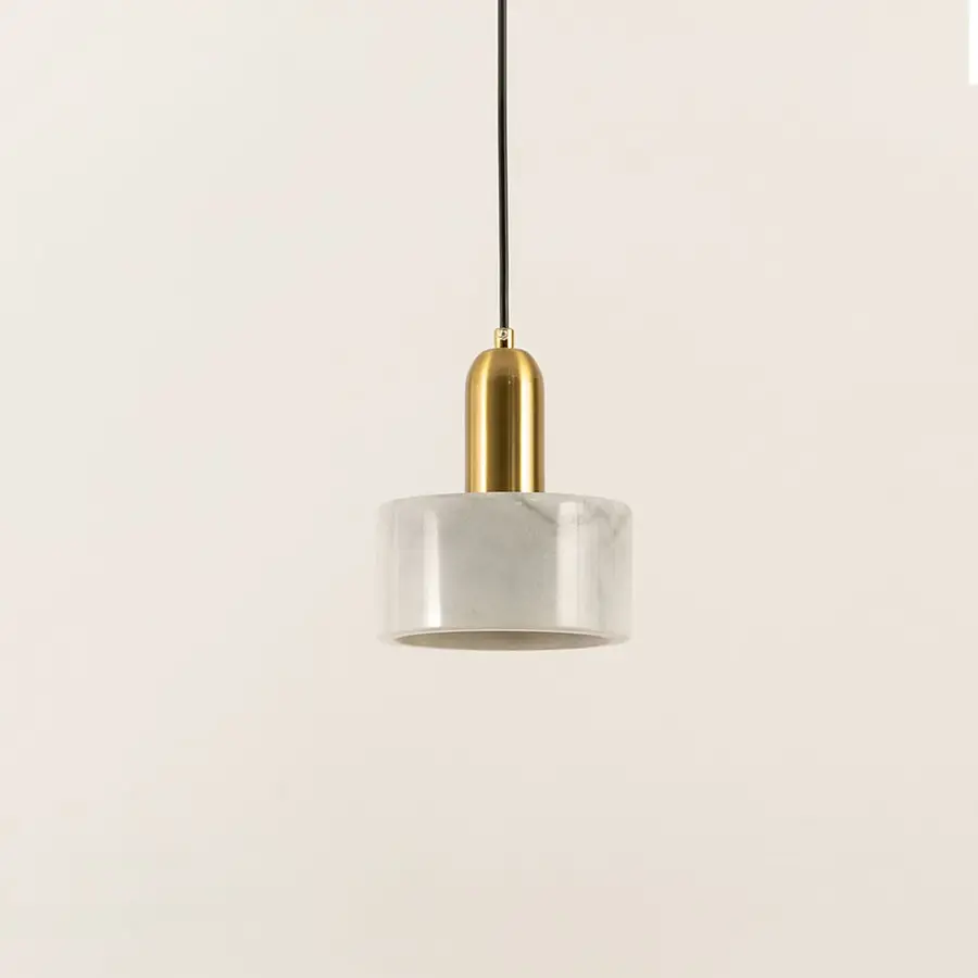 Minimalist white marble pendant light with cylindrical design created for elegant living spaces.