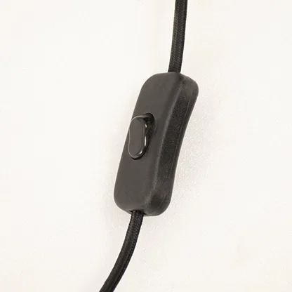 Black inline switch on table lamp power cord designed for convenient operation and reliable everyday lighting control.