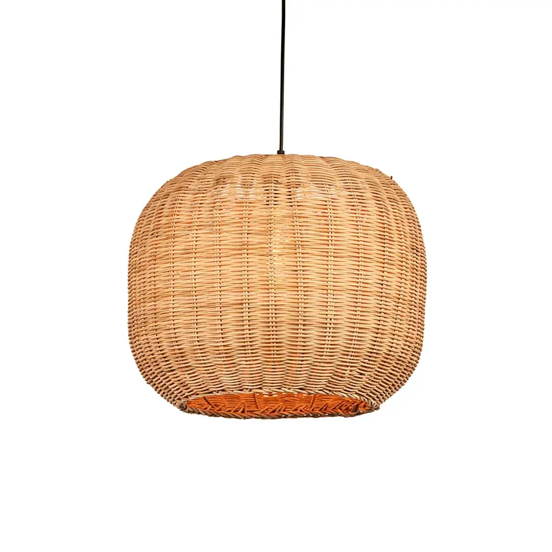 Natural rattan pendant light with round globe shape and tight woven texture hanging against soft neutral wall background for warm modern decor.