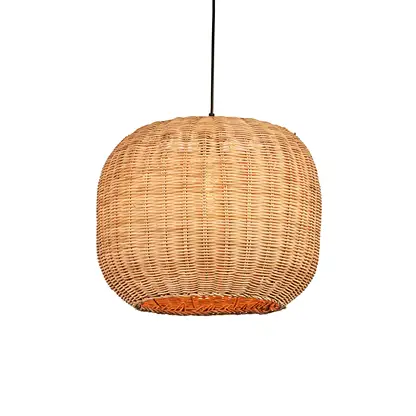 Natural rattan pendant light with round globe shape and tight woven texture hanging against soft neutral wall background for warm modern decor.