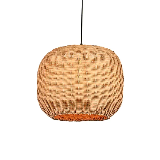 Natural rattan pendant light with round globe shape and tight woven texture hanging against soft neutral wall background for warm modern decor.