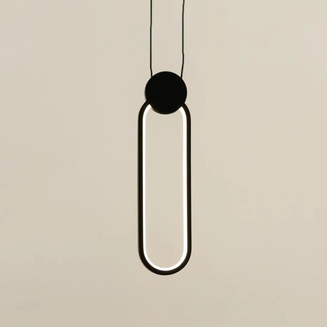 Modern black metal ring pendant light with sleek geometric styling designed for elegant interiors.