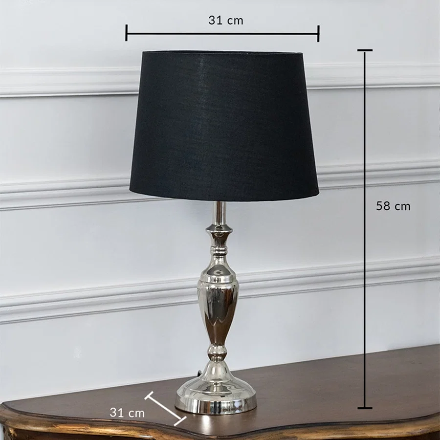 Black table lamp with brass base dimensions 31 cm width and 58 cm height showcasing its ideal fit for any space.