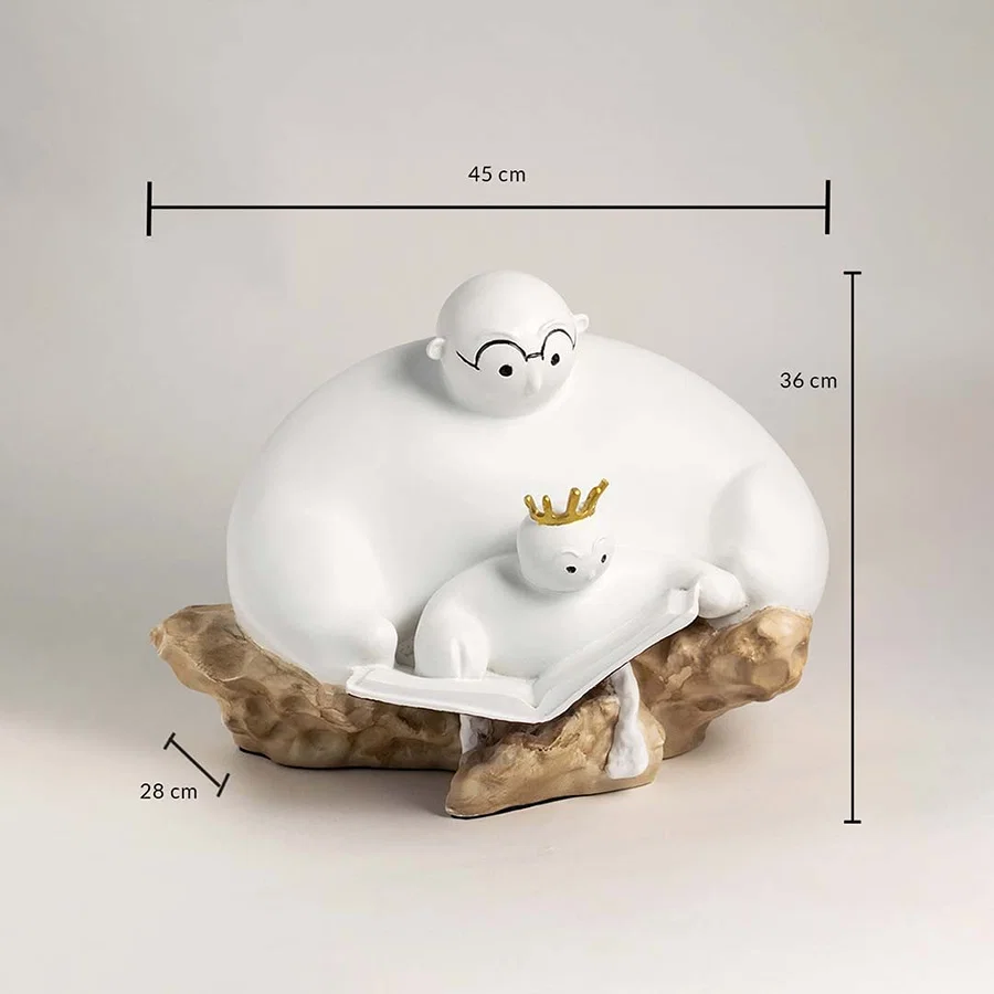 Parent and child sculpture in white ceramic with golden crown showing 45 cm length 36 cm height 28 cm width.