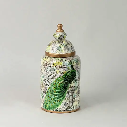 Decorative ceramic jar with parrot illustration and botanical pattern placed on white surface against neutral background showcasing premium nature inspired home decor accent.