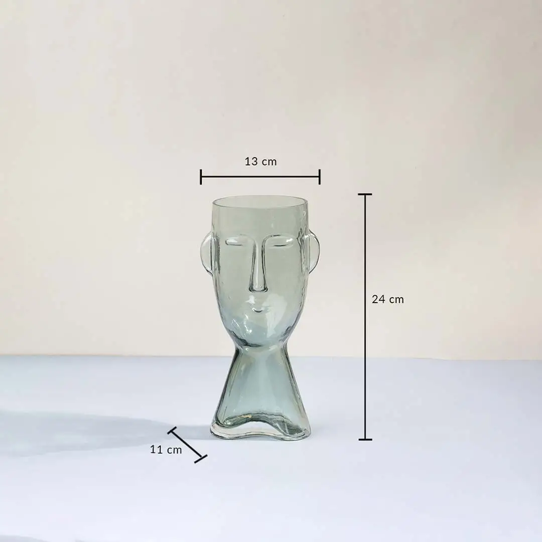 Face shaped glass vase modern abstract design transparent finish decorative accent piece with size shown light on white background.