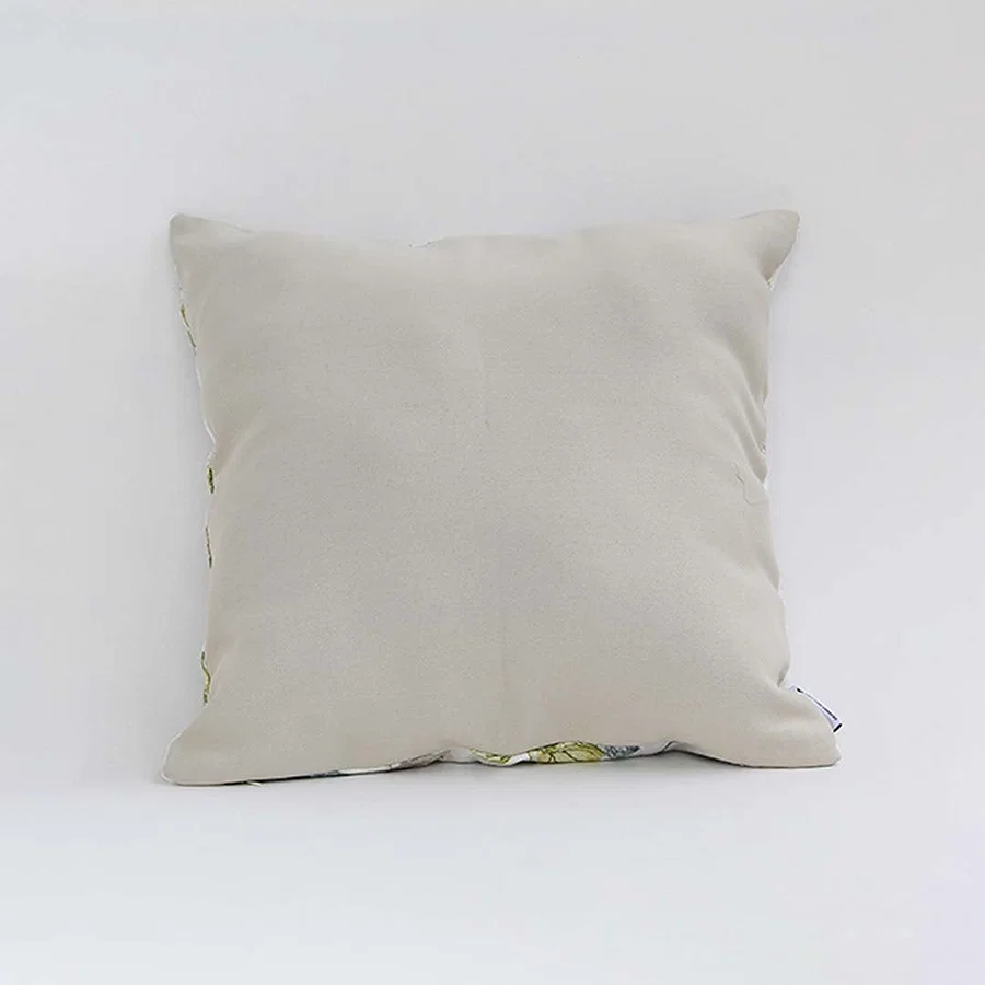 Backside of the cushion cover displayed in beige cotton fabric providing a smooth natural décor style with a breathable gentle and skin friendly texture ideal for sofas beds and interiors.