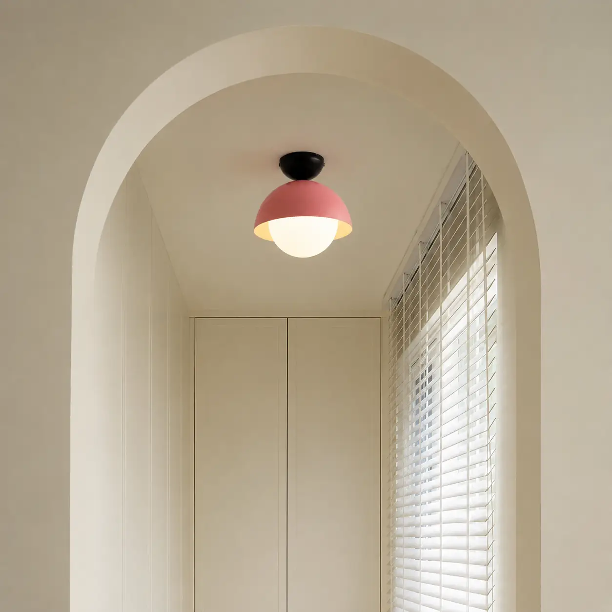 Modern pink metal flush ceiling light for hallway bedroom and contemporary home interiors with warm ambient lighting.