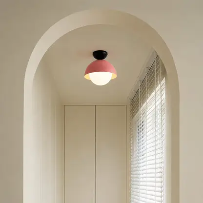 Modern pink metal flush ceiling light for hallway bedroom and contemporary home interiors with warm ambient lighting.