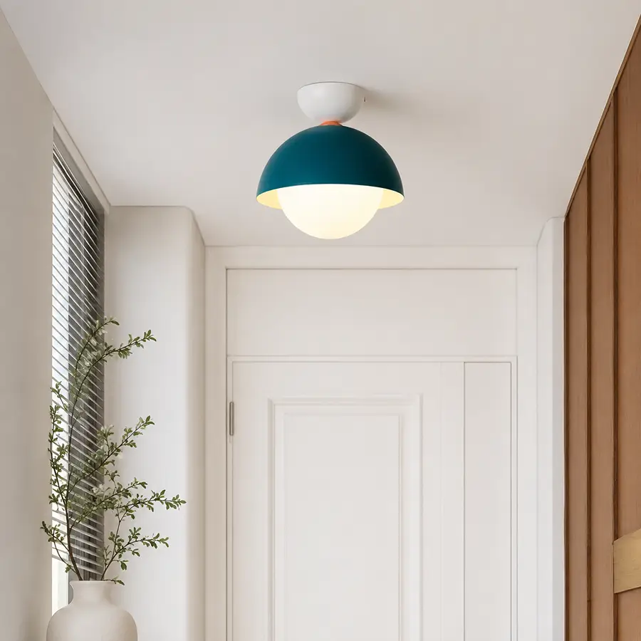 Modern dome ceiling light styled in a clean room setting with a soft white glow and contemporary round shape.