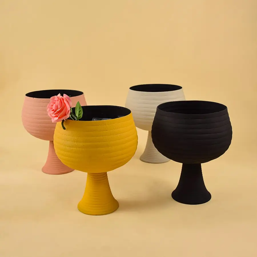 Set of cream metal pedestal bowls displayed together showing modern textured design ideal for centre tables and consoles.