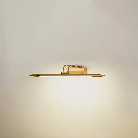 Elegant wall light in gold metal finish with linear bar design for bathroom or vanity decor lighting white background.