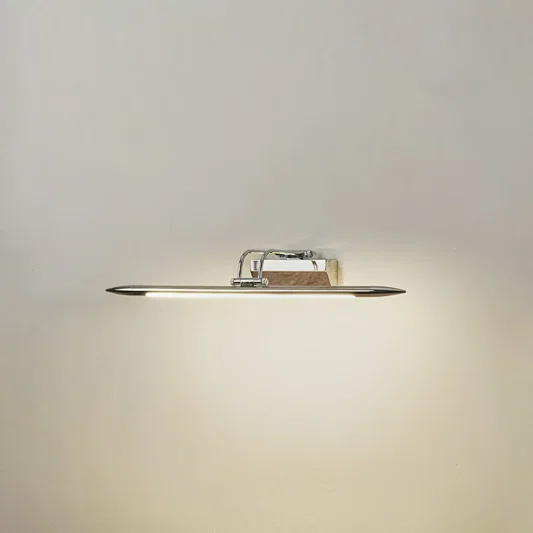 Minimal wall light in chrome metal finish with linear bar design for bathroom or vanity decor lighting white background.