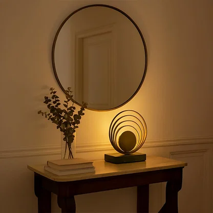 Designer marble base table lamp with golden circular rings blending art and functionality for sophisticated living spaces and home decor.