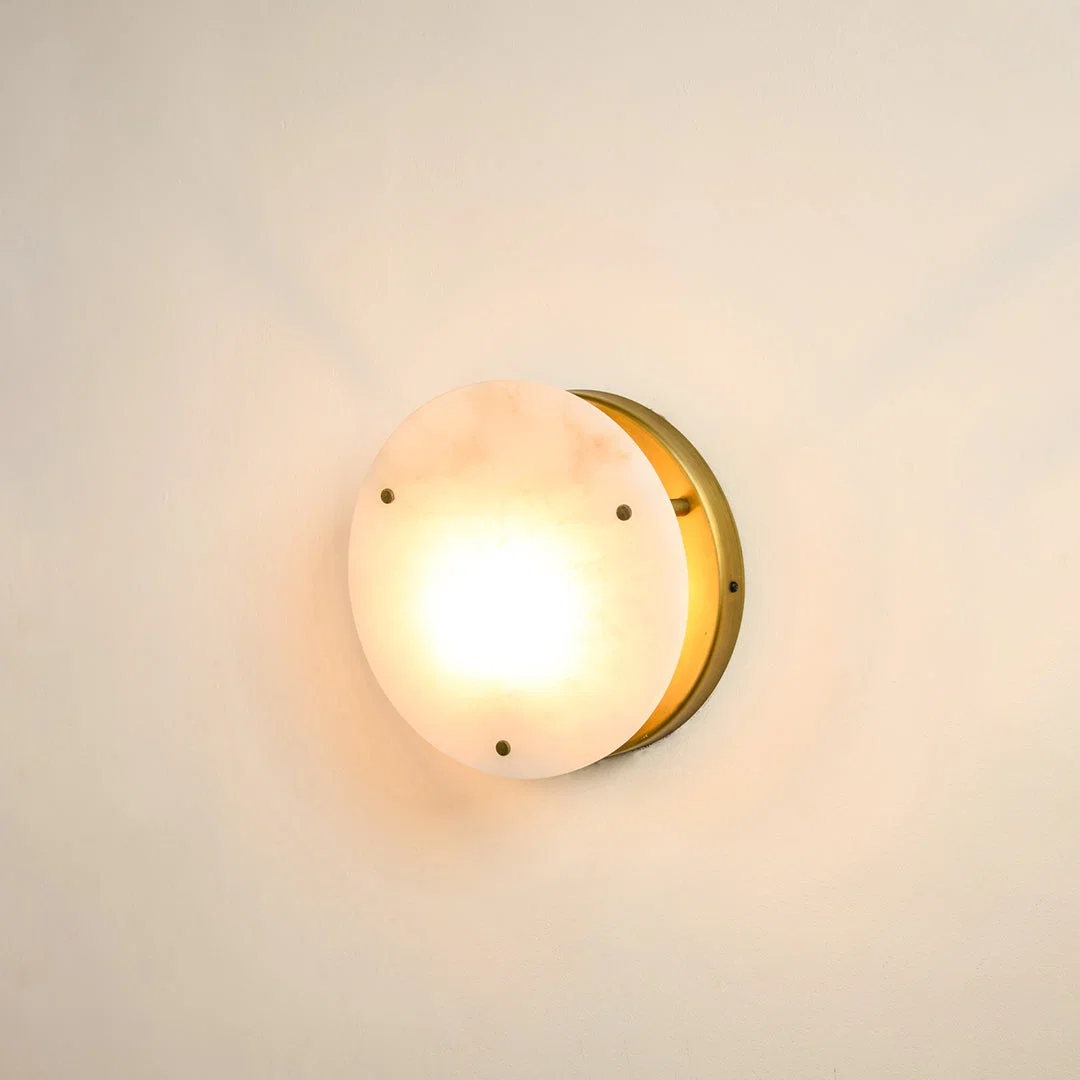 Modern marble wall light with warm ambient glow for elegant hallway and luxury decor styling spaces.
