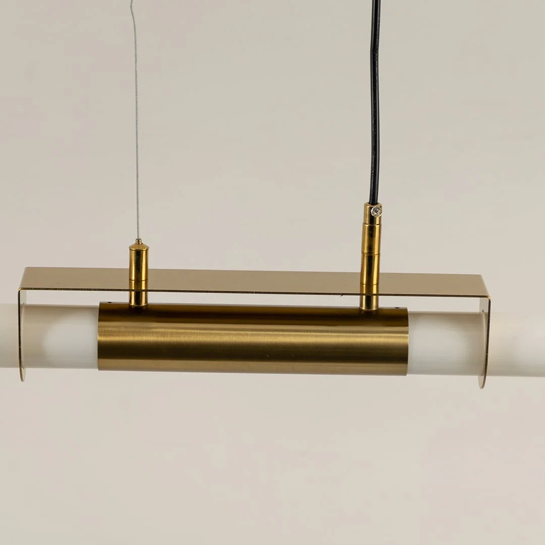 Gold metal linear LED pendant light highlighting refined metal construction and contemporary minimalist lighting design.