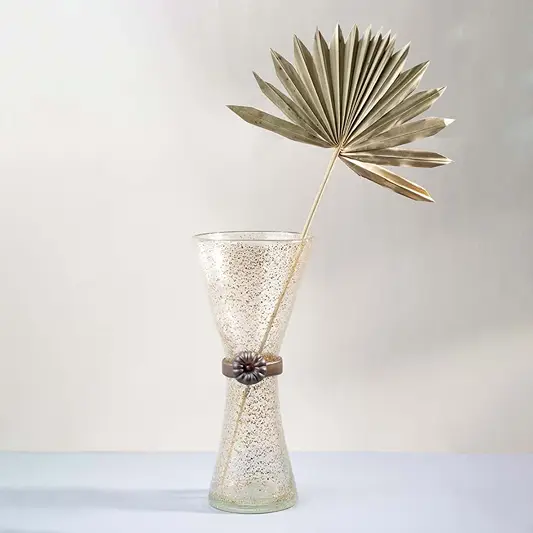 Golden speckled tall glass vase with hourglass design displayed on plain white background for stylish home decor use.