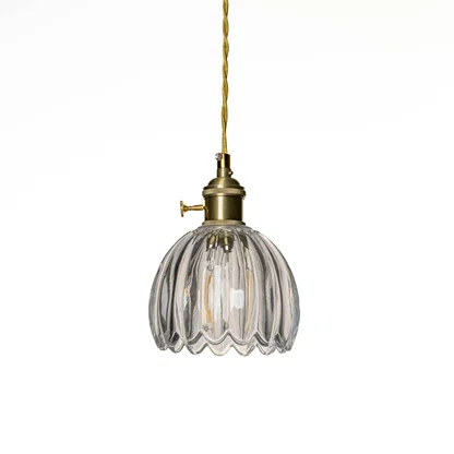 Clear ribbed glass pendant light with polished gold fittings designed for elegant modern spaces.