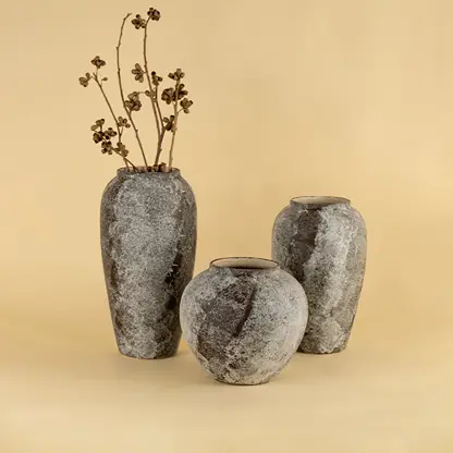 Decorative rustic ceramic vases in grey stone textured finish perfect for modern and traditional home styling.