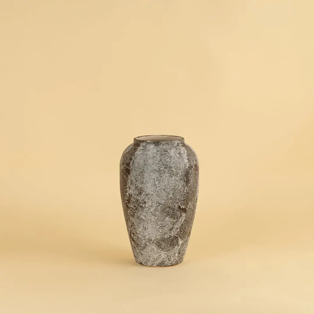 Rustic ceramic vase in grey brown textured stone look ideal for enhancing living room and entryway decor.