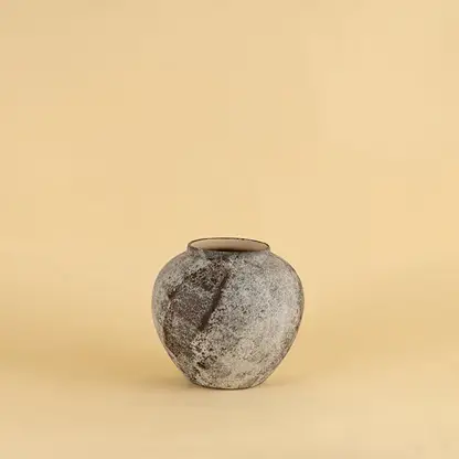 Round rustic ceramic vase with grey and brown textured finish ideal for modern and traditional interiors.