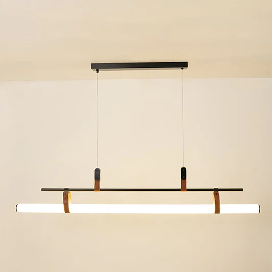 Black metal linear LED pendant light with integrated illumination creating sleek modern ambient ceiling lighting indoors.
