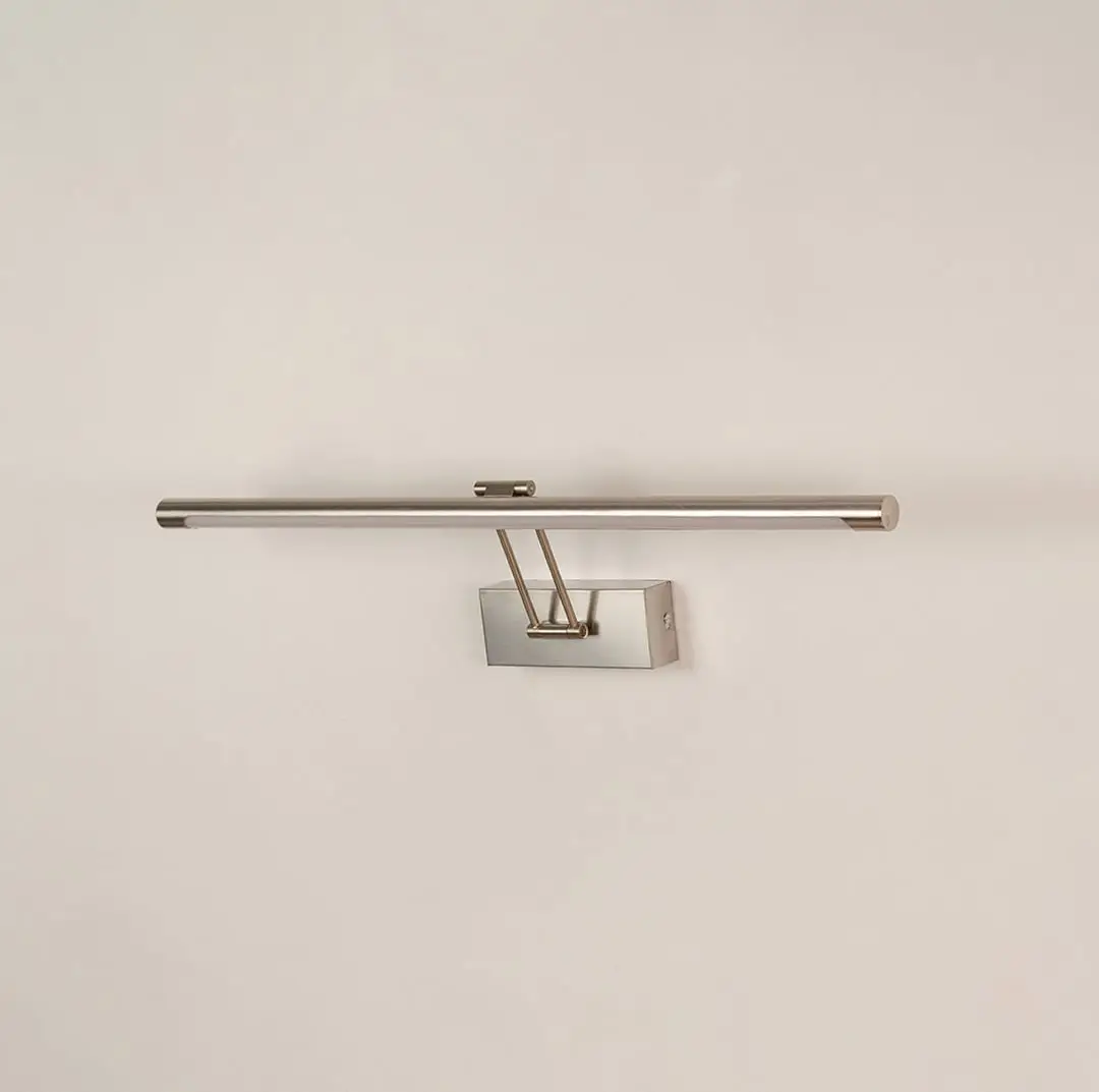 Silver picture light displayed on white background with light off showing clean metal finish and contemporary wall mounting style.