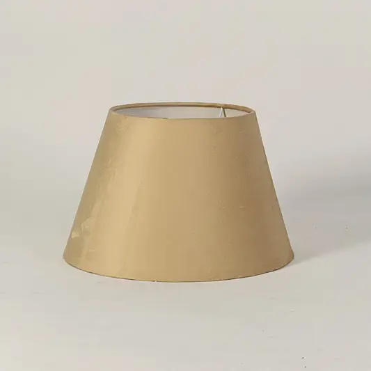 Elegant fabric lampshade in beige finish for table or floor lamp soft lighting and home decor placement white background.

