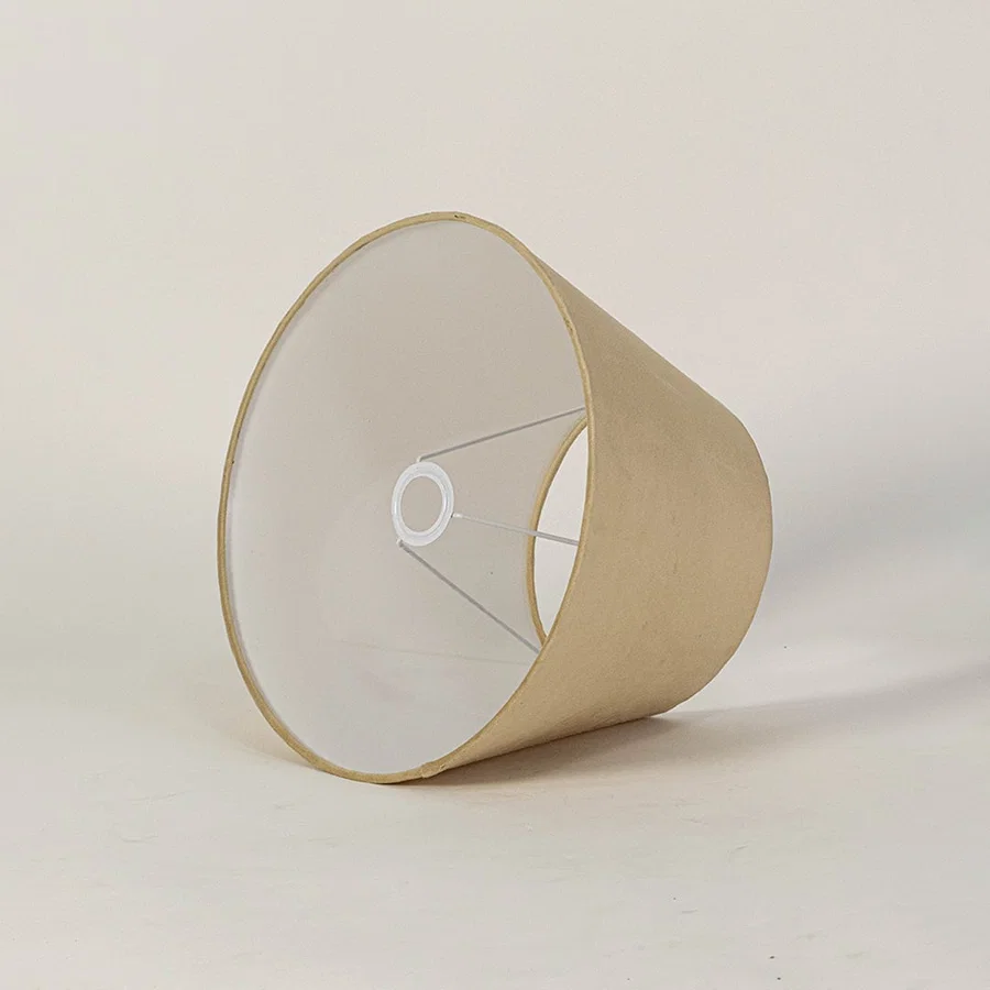 Beige tapered lampshade displayed on a clean white background highlighting its smooth fabric texture and wide base for a warm modern decorative lighting look.