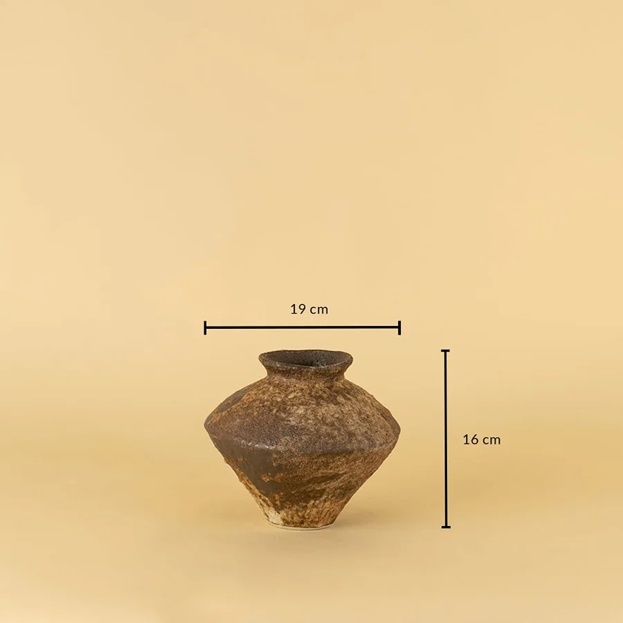 Rustic brown ceramic vase with handcrafted texture shown with 16 cm height and 19 cm width for size reference.