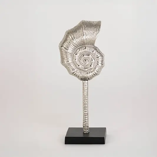 Decorative silver spiral sculpture on a black stand displayed against a clean white background showing its textured artistic design