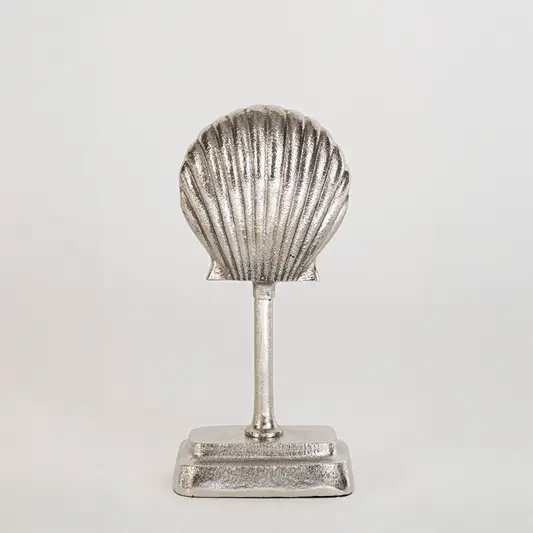 Decorative shell sculpture in silver finish for table decor or shelf styling modern home placement white background.