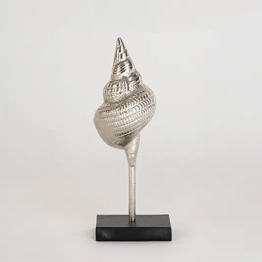 Artistic shell sculpture in silver finish with stand for table decor or shelf styling modern home placement white background.