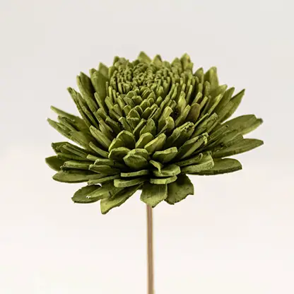 Zoomed-in view of artificial green chrysanthemum flower head with lifelike detailing for home decor.