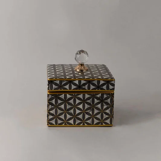 Elegant handcrafted ceramic jar with gold geometric pattern and crystal lid accent ideal for luxury home styling.